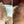 Before and after image of a woman with wavy blonde hair and thin hair on her crown and parting line